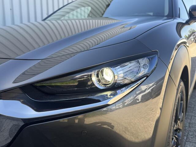 Mazda CX-30 2.0 e-SkyActiv-X M Hybrid Homura | Dodehoeksensoren | Draadloze Applecarplay en Android Auto | Adaptieve Cruise Control | Automaat | 18inch zwarte velgen | Achteruitrijcamera | Elektrische achterklep |