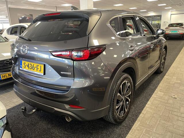 Mazda CX-5 2.0 SkyActiv-G 165 Luxury Automaat, Trekhaak, Leder, Keyblocker, Bose, HUD, Adap. Cruise, Stoelverwarming, Stoelverkoeling, Stuurverwarming, Clima, 360 Camera, Navi, HUD, Bose, LKA, Elektrische klep