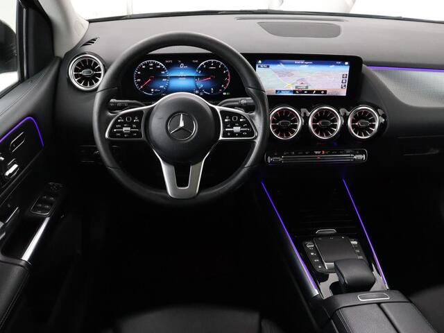 Mercedes-Benz B-KLASSE 180 Business Solution Luxury | Panoramadak | Leder | Stoelverwarming | Trekhaak | Memory | Keyless | Matrix LED | Sfeerverlichting | Navigatie | Widescreen