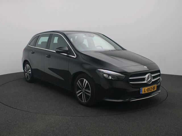 Mercedes-Benz B-KLASSE 180 Business Solution Luxury Trekhaak | Parkeerpakket met achteruitrijcamera | Ledkoplampen | Sfeerverlichting | Stoelverwarming. Inclusief 24 maanden MB Certified garantie voor Europa.