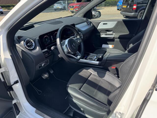 Mercedes-Benz B-KLASSE 250 e Business Solution AMG Limited VAN: 30.900,- VOOR: 28.877,- UW WKVOORDEEL: 2.23- | PANORAMA DAK | 360 CAMERA | SFEER VERLICHTING | ADAPTIEF CRUISE CONTROL | MEMORY OP STOEL | HEAD-UP DISPLAY | 12 MND BOVAG GARANTIE |