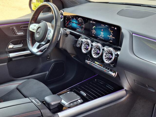Mercedes-Benz B-KLASSE 180 Business Solution AMG | Panoramadak | Trekhaak Afneembaar | Night Pakket | Achteruitrijcamera | Memory Pakket | Sfeerverlichting | Stoelverwarming | Advanced Sound System | Dodehoekassistentie | Multibeam LED | Keyless-GO | Elektrisch Bedienbare Achte