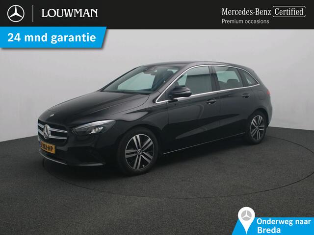 Mercedes-Benz B-KLASSE 180 Business Solution Luxury Ledkoplampen | Parkeerpakket met achteruitrijcamera | Sfeerverlichting | Easy-Pack achterklep | Stoelverwarming. Inclusief 24 maanden MB Certified garantie voor Europa.