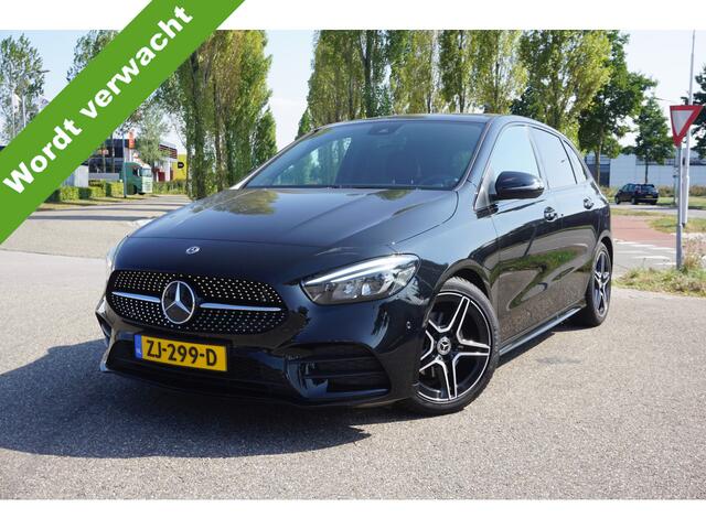 Mercedes-Benz B-KLASSE 180 Business Solution AMG l Trekhaak l MBUX l Stoelverwarming l Virtual Cockpit l Smartphone Integratie l Spiegel pakket l LED High Performance l Airconditioning THERMOTRONIC l Night pakket l Licht en zicht pakket l Tempomaat l Electrisch bedienbare achterklep l