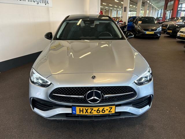 Mercedes-Benz C-KLASSE Estate 180 AMG Line | Panoramadak | Sfeerverlichting | Achteruitrijcamera | Cruise control | Adaptief onderstel | Lane assist | Dodehoeksdetectie | Stoelverwarming | Apple carplay