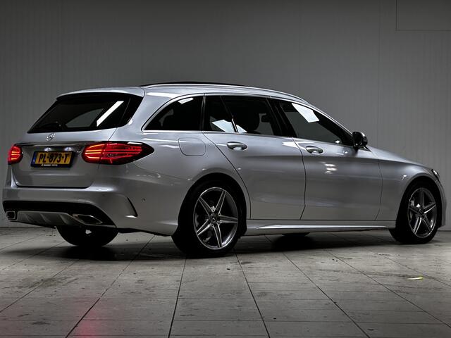 Mercedes-Benz C-KLASSE Estate 180 AMG Business Solution/ AMG-Pakket/ Panorama-Dak/ 18''LMV/ Zwarte-Hemel/ Camera/ Elek. Stoelen/ LED Koplampen/ Sportstoelen/ Elek. Kofferklep/ Bluetooth/ Multi. Sportstuur.