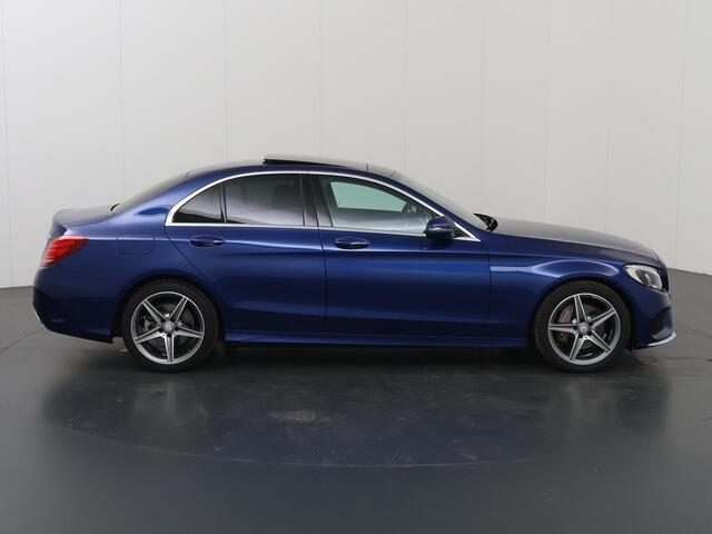 Mercedes-Benz C-KLASSE 180 Business Solution | AMG | Panoramadak | Lederen bekleding | Achteruitrijcamera | High Performance koplampen | Navigatie |