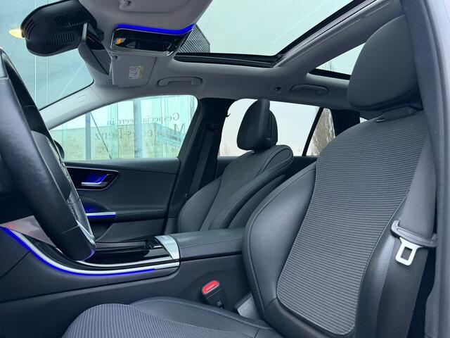 Mercedes-Benz C-KLASSE Estate 300 e Business Line Limited I Panorama dak I 360 camera I MBUX l Stoelverwarming I Sfeerverlichting l Tempomaat I Elektrische bed. Achterklep l Zomer en Winterset ( op afbeelding Winter ) l Voorverwarming l