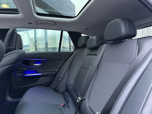 Mercedes-Benz C-KLASSE Estate 300 e Business Line Limited I Panorama dak I 360 camera I MBUX l Stoelverwarming I Sfeerverlichting l Tempomaat I Elektrische bed. Achterklep l Zomer en Winterset ( op afbeelding Winter ) l Voorverwarming l