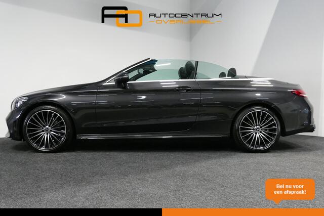 Mercedes-Benz C-KLASSE Cabrio 180 AMG Line / C63S AMG Diffuser / Nekverwarming - Airscarf / Panamericana Grille / Stoelverwarming / Apple Carplay - Android Auto / Full LED / Ambienteverlichting / Achteruitrijcamera / Cruise Control / Dodehoekdetectie / 20'' LMV