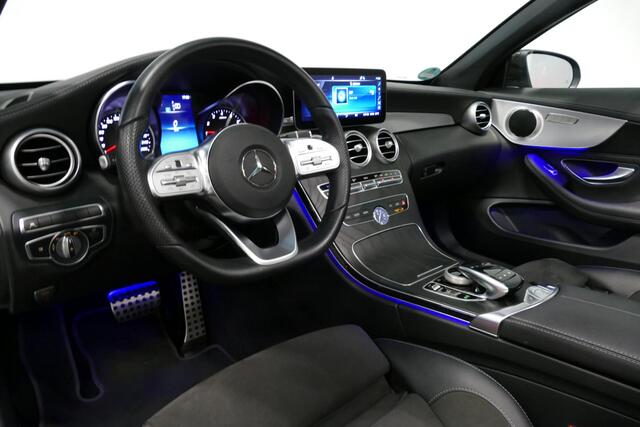 Mercedes-Benz C-KLASSE Cabrio 180 AMG Line / C63S AMG Diffuser / Nekverwarming - Airscarf / Panamericana Grille / Stoelverwarming / Apple Carplay - Android Auto / Full LED / Ambienteverlichting / Achteruitrijcamera / Cruise Control / Dodehoekdetectie / 20'' LMV