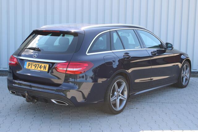 Mercedes-Benz C-KLASSE Estate 180 Business Solution AMG | Incl. 12 maanden garantie | Lederen sportstoelen | Cruise control | Climate control | Trekhaak | Zwarte hemel | LED Koplampen | 18" LM | Elektrische achterklep | Achteruitrijcamera | Dodehoek detectie |