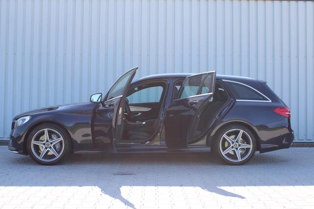 Mercedes-Benz C-KLASSE Estate 180 Business Solution AMG | Incl. 12 maanden garantie | Lederen sportstoelen | Cruise control | Climate control | Trekhaak | Zwarte hemel | LED Koplampen | 18" LM | Elektrische achterklep | Achteruitrijcamera | Dodehoek detectie |