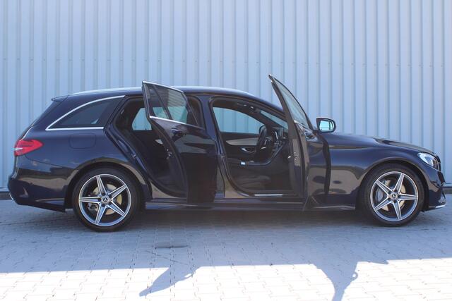Mercedes-Benz C-KLASSE Estate 180 Business Solution AMG | Incl. 12 maanden garantie | Lederen sportstoelen | Cruise control | Climate control | Trekhaak | Zwarte hemel | LED Koplampen | 18" LM | Elektrische achterklep | Achteruitrijcamera | Dodehoek detectie |