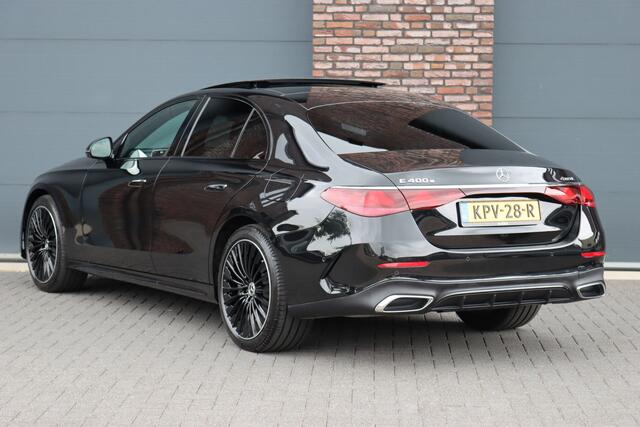 Mercedes-Benz E-KLASSE 400 e 4MATIC AMG Line | Luchtvering | Achterasbesturing | Hyperscreen | Distronic+ | Trekhaak | Digital Light | HUD | Burmester | Achterbank Verwarmd |3D-Display |