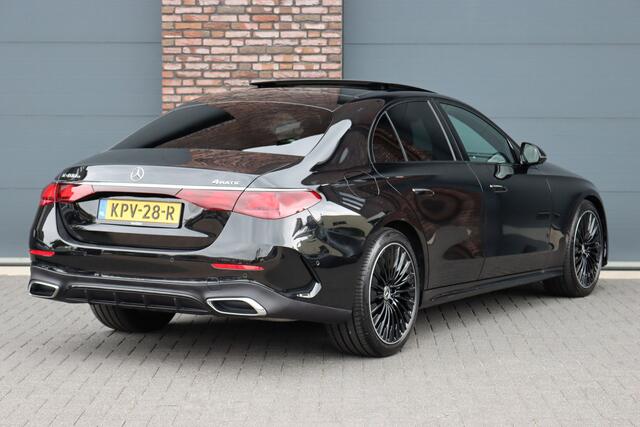 Mercedes-Benz E-KLASSE 400 e 4MATIC AMG Line | Luchtvering | Achterasbesturing | Hyperscreen | Distronic+ | Trekhaak | Digital Light | HUD | Burmester | Achterbank Verwarmd |3D-Display |