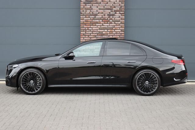 Mercedes-Benz E-KLASSE 400 e 4MATIC AMG Line | Luchtvering | Achterasbesturing | Hyperscreen | Distronic+ | Trekhaak | Digital Light | HUD | Burmester | Achterbank Verwarmd |3D-Display |