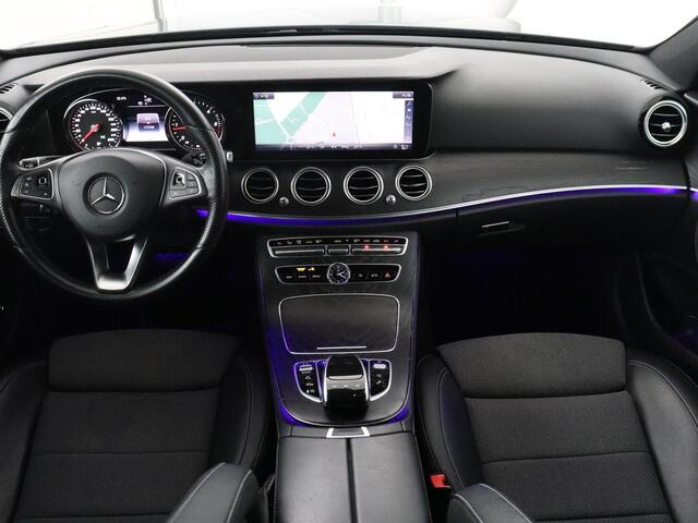 Mercedes-Benz E-estate 200 d | Half Leder | Trekhaak | Camera | Adaptive cruise | Sfeerverlichting | Park assist | Navigatie | Full LED |