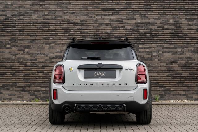 Mini COUNTRYMAN 1.5 Cooper SE Hybride ALL4 JCW-Trim | Navigatie | Panorama | Half Leder | Camera | Head-Up | 18"LM | White Silver