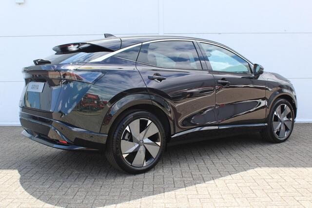 Nissan Ariya Evolve 87 kWh / 20" LM velgen / Stoelverwarming voor en achter / Automatische airco / Apple Carplay & Android Auto / Bluetooth telefoonvoorbereiding / Cruise control adaptief / DAB / Elektrisch glazen panorama-dak / Privacy glass / Stuurwiel verwarmd / Ro