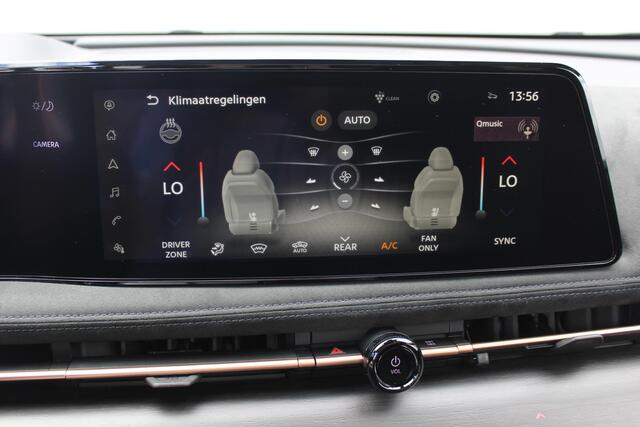 Nissan Ariya Evolve 87 kWh / 20" LM velgen / Stoelverwarming voor en achter / Automatische airco / Apple Carplay & Android Auto / Bluetooth telefoonvoorbereiding / Cruise control adaptief / DAB / Elektrisch glazen panorama-dak / Privacy glass / Stuurwiel verwarmd / Ro