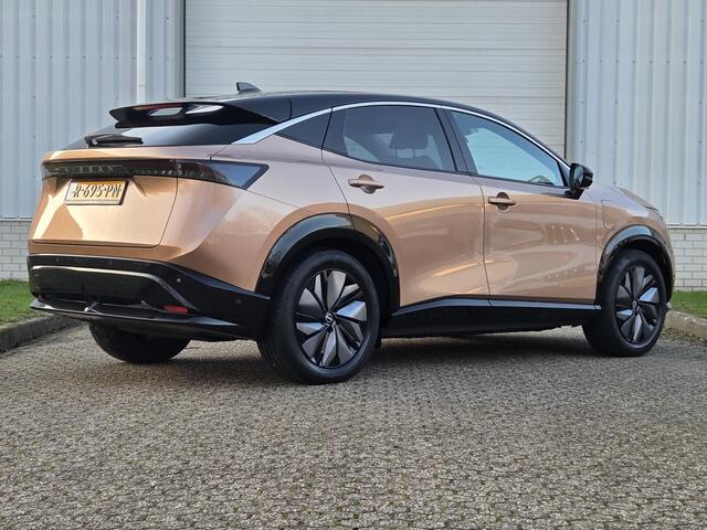 Nissan Ariya Evolve 91 kWh / SOH 99% / Panoramadak / 360 Graden Camera / Adaptief Cruise Control / Elektrisch Verstelbare Stoelen met Geheugen / Achterbank Verwarming / Stoel & Stuurverwarming / Stoel Verkoeling / Elektrische Achterklep / 1e Eigenaar / Dealer Onderhou