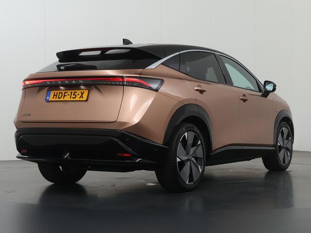 Nissan Ariya Trend Plus 91 kWh | SOH 99% | Trekhaak | Elektrisch verstelbare stoelen + Geheugen | BOSE audio | Stoelverwarming voor + achter | Navigatie | 360 Camera | DAB | Apple CarPlay/Android Auto | Stuurverwarming | Panoramadak | HUD | Adaptieve Cruise Control |