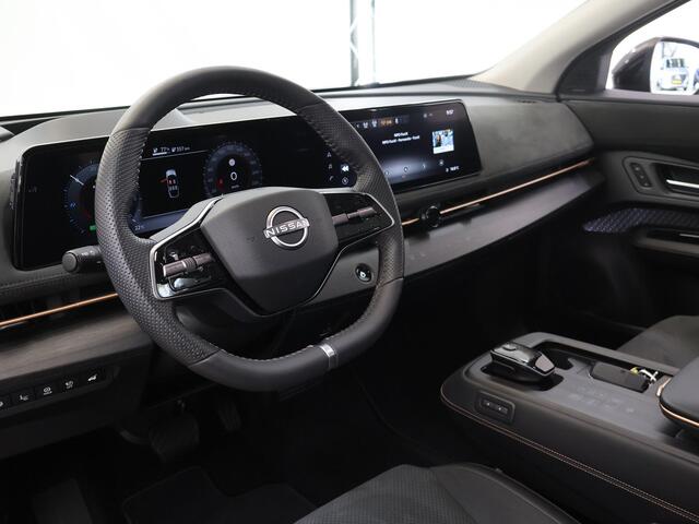 Nissan Ariya Trend Plus 91 kWh | SOH 99% | Trekhaak | Elektrisch verstelbare stoelen + Geheugen | BOSE audio | Stoelverwarming voor + achter | Navigatie | 360 Camera | DAB | Apple CarPlay/Android Auto | Stuurverwarming | Panoramadak | HUD | Adaptieve Cruise Control |