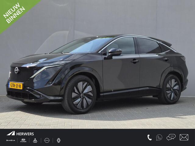 Nissan Ariya Advance 91 kWh / SOH 99% / Fabrieksgarantie tot 12-2027 / CCS snelladen / warmtepomp / Stuur- Stoel & Voorruitverwarming / Apple Carplay Android Auto / Adaptief cruise control / Keyless Enty/Start / Elektrische achterklep /