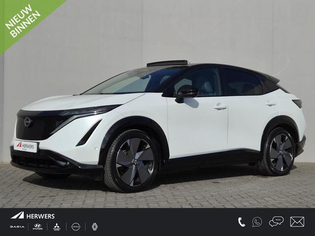 Nissan Ariya e-4ORCE Evolve 91 kWh / SOH 99% / Fabrieksgarantie tot 01-2027 / CCS snelladen / Trekgewicht 1500 kg / Warmtepomp / Bose Audio Systeem / Stoelventilatie / Elektrische achterklep / Head Up Display / Glazen schuif- en kanteldak / Stuur- Stoel & Achterbank verwarming / Rondomzicht camera /