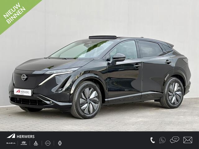 Nissan Ariya e-4ORCE Evolve 91 kWh 4WD / 306 PK / Leder / 1.500 kg Trekgewicht / Warmtepomp / 10 jaar Nissan More Garantie / Stoelverwarming voor en achter / Schuif-kantel dak / HUD / Stoelventilatie / Stuurverwarming / Rondomzicht camera / Elektrisch verstelbare stoelen met geheugen / Elektrische achterklep / Adaptieve cruise control / Apple Carplay/Android Auto /