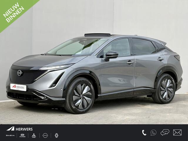 Nissan Ariya e-4ORCE Evolve 91 kWh 4WD / 306 PK / Leder / 1.500 kg Trekgewicht / Warmtepomp / 10 jaar Nissan More Garantie / Stoelverwarming voor en achter / Schuif-kantel dak / Stoelventilatie / Stuurverwarming / Rondomzicht camera / Elektrisch verstelbare stoelen met geheugen / Elektrische achterklep / Adaptieve cruise control / Apple Carplay/Android Auto /