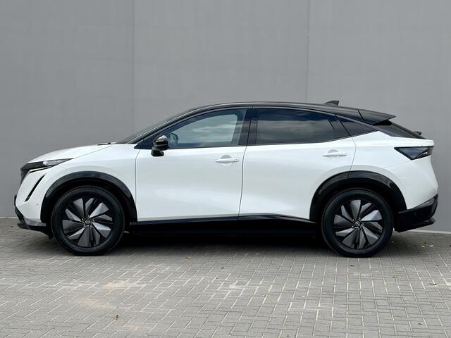 Nissan Ariya e-4ORCE Evolve 91 kWh 4WD / 306 PK / Leder / 1.500 kg Trekgewicht / Warmtepomp / 10 jaar Nissan More Garantie / Stoelverwarming voor en achter / Schuif-kantel dak / Stoelventilatie / Stuurverwarming / Rondomzicht camera / Elektrisch verstelbare stoelen met geheugen / Elektrische achterklep / Adaptieve cruise control / Apple Carplay/Android Auto /