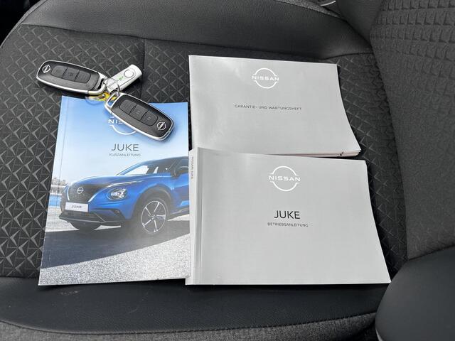 Nissan JUKE 1.0 DIG-T N-Connecta DCT Automaat / Trekgewicht 1.250 kg / Cold pack / Stuur-, Stoel en voorruitverwarming / Navigatie / Apple Carplay Android Auto / Achteruitrijcamera / Climate control / 17" LM wielen