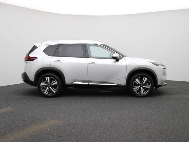 Nissan X-TRAIL 1.5 e-4orce Tekna 4WD 7p. 214pk | Afneembare Trekhaak | Glazen Schuif-Kanteldak | Stoel- & Stuurwielverwarming | 360-graden Camera | ProPilot | Achterbank Verwarmd | Lederen Bekleding | Memory Seats | Elektrische Achterklep