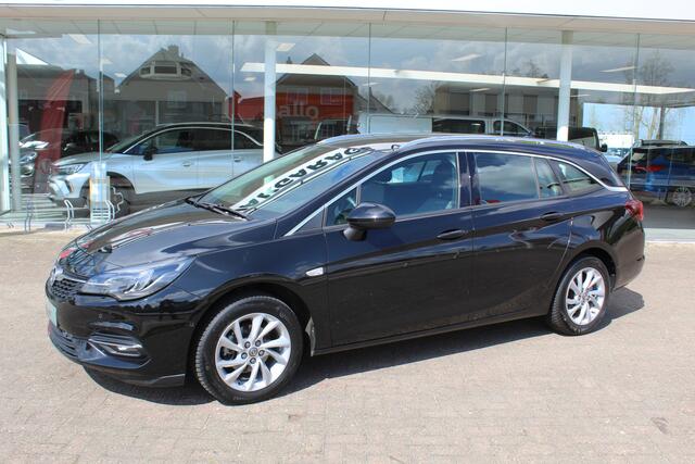 Opel ASTRA Sports Tourer 1.2-110pk Elegance. Ruime, sportieve, luxe en degelijke gezinswagen ! Autm. airco, stoel- en stuurwiel verw., LED verl., camera, parkeersens. v+a, metallic lak, LM wielen, Apple carplay/Android auto, navigatie, telefoonvoorb., cruise cntrl e
