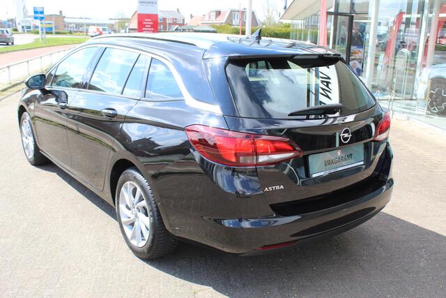 Opel ASTRA Sports Tourer 1.2-110pk Elegance. Ruime, sportieve, luxe en degelijke gezinswagen ! Autm. airco, stoel- en stuurwiel verw., LED verl., camera, parkeersens. v+a, metallic lak, LM wielen, Apple carplay/Android auto, navigatie, telefoonvoorb., cruise cntrl e