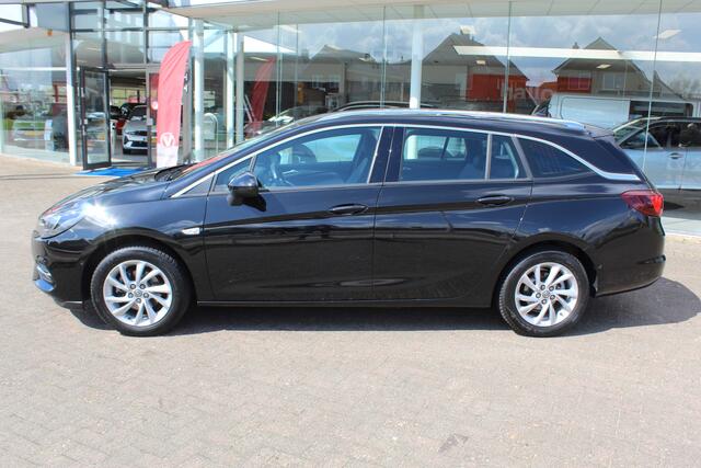 Opel ASTRA Sports Tourer 1.2-110pk Elegance. Ruime, sportieve, luxe en degelijke gezinswagen ! Autm. airco, stoel- en stuurwiel verw., LED verl., camera, parkeersens. v+a, metallic lak, LM wielen, Apple carplay/Android auto, navigatie, telefoonvoorb., cruise cntrl e
