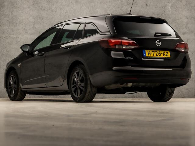 Opel ASTRA Sports Tourer 1.2 Sport (APPLE CARPLAY, NAVIGATIE, CLIMATE, ADAPTIVE CRUISE, GETINT GLAS, KOPLAMPEN, SPORTSTOELEN, PARKEERSENSOREN, NIEUWSTAAT)