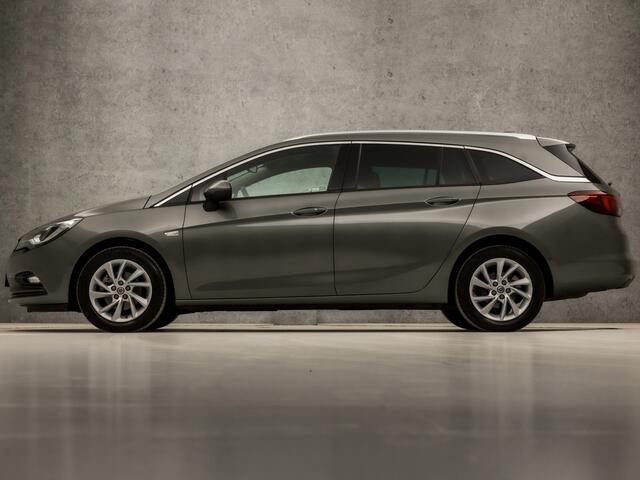 Opel ASTRA Sports Tourer 1.0 Innovation Sport (APPLE CARPLAY, GROOT NAVI, CLIMATE, LEDER, GETINT GLAS, SPORTSTOELEN, CAMERA, LM VELGEN, LED KOPLAMPEN, NIEUWSTAAT)
