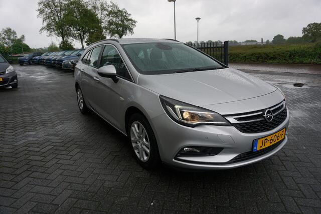 Opel ASTRA Sports Tourer 1.0 BUSINESS+ ORIGINEEL NEDERLANDS NAVIGATIE ANDROID/APPLECARPLAY TREKHAAK ECC AIRCO CRUISECONTROL PARKEERSENSOREN V+A BLUETOOTH CHROOM 4X ELECTR.RAMEN/SPIEGELS