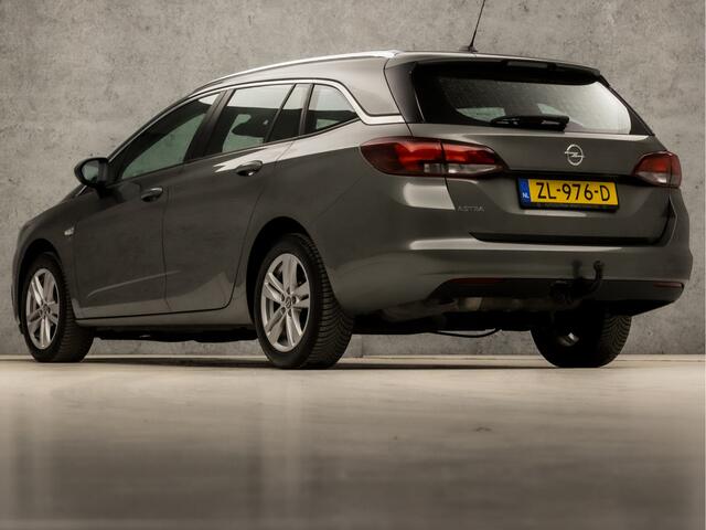 Opel ASTRA Sports Tourer 1.4 Turbo 120 Jaar Edition 150Pk (APPLE CARPLAY, NAVIGATIE, TREKHAAK, CRUISE, SPORTSTOELEN, LM VELGEN, NIEUWE APK, NIEUWSTAAT)