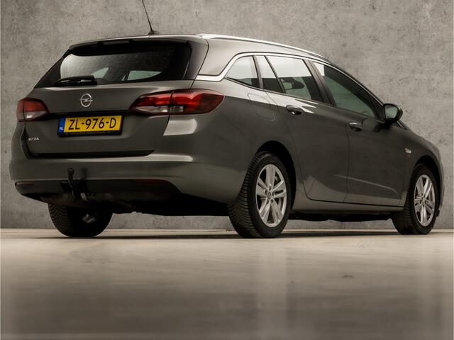 Opel ASTRA Sports Tourer 1.4 Turbo 120 Jaar Edition 150Pk (APPLE CARPLAY, NAVIGATIE, TREKHAAK, CRUISE, SPORTSTOELEN, LM VELGEN, NIEUWE APK, NIEUWSTAAT)