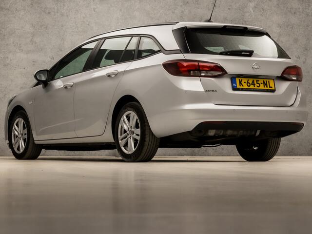 Opel ASTRA Sports Tourer 1.4 Sport 146Pk Automaat (APPLE CARPLAY, NAVIGATIE, CLIMATE, CAMERA, SPORTSTOELEN, LM VELGEN, PARKEERSENSOREN, CRUISE, NIEUWSTAAT)