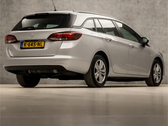 Opel ASTRA Sports Tourer 1.4 Sport 146Pk Automaat (APPLE CARPLAY, NAVIGATIE, CLIMATE, CAMERA, SPORTSTOELEN, LM VELGEN, PARKEERSENSOREN, CRUISE, NIEUWSTAAT)