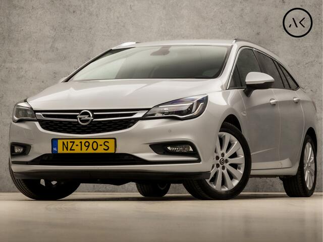 Opel ASTRA Sports Tourer 1.0 Sport (APPLE CARPLAY, GROOT NAVI, GETINT GLAS, TREKHAAK, PARKEERSENSOREN, SPORTSTOELEN, CRUISE, LM VELGEN, NIEUWE APK, NIEUWSTAAT)