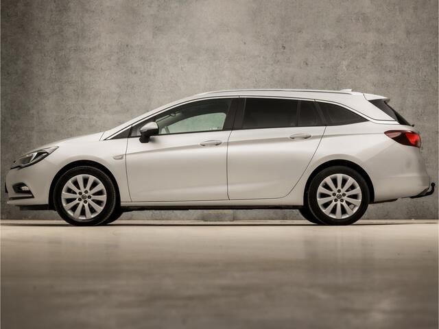 Opel ASTRA Sports Tourer 1.0 Sport (APPLE CARPLAY, GROOT NAVI, GETINT GLAS, TREKHAAK, PARKEERSENSOREN, SPORTSTOELEN, CRUISE, LM VELGEN, NIEUWE APK, NIEUWSTAAT)