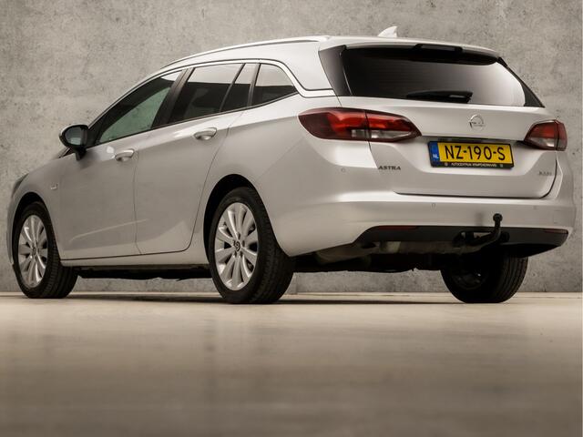 Opel ASTRA Sports Tourer 1.0 Sport (APPLE CARPLAY, GROOT NAVI, GETINT GLAS, TREKHAAK, PARKEERSENSOREN, SPORTSTOELEN, CRUISE, LM VELGEN, NIEUWE APK, NIEUWSTAAT)