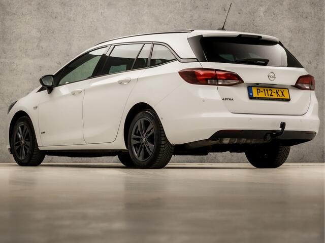 Opel ASTRA Sports Tourer 1.2 Sport (APPLE CARPLAY, NAVIGATIE, CLIMATE, CAMERA, ADAPTIVE CRUISE, SPORTSTOELEN, GETINT GLAS, LEDER, TREKHAAK, NIEUWSTAAT)