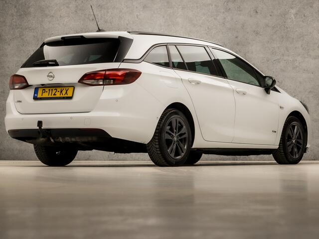 Opel ASTRA Sports Tourer 1.2 Sport (APPLE CARPLAY, NAVIGATIE, CLIMATE, CAMERA, ADAPTIVE CRUISE, SPORTSTOELEN, GETINT GLAS, LEDER, TREKHAAK, NIEUWSTAAT)